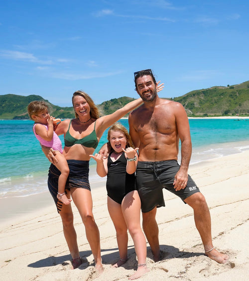 Karstan and Maxine along with their kids on the beach